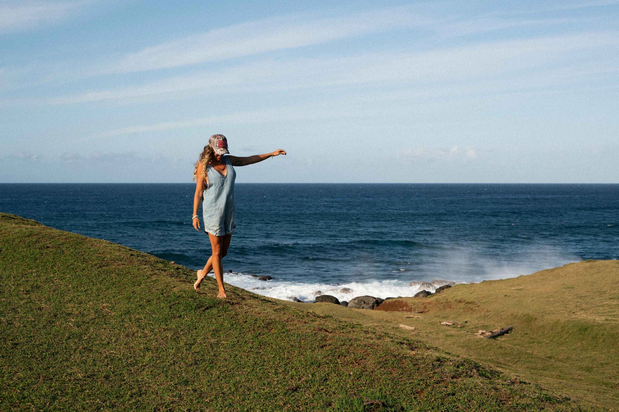 ocean view with girl wearing a baseball cap