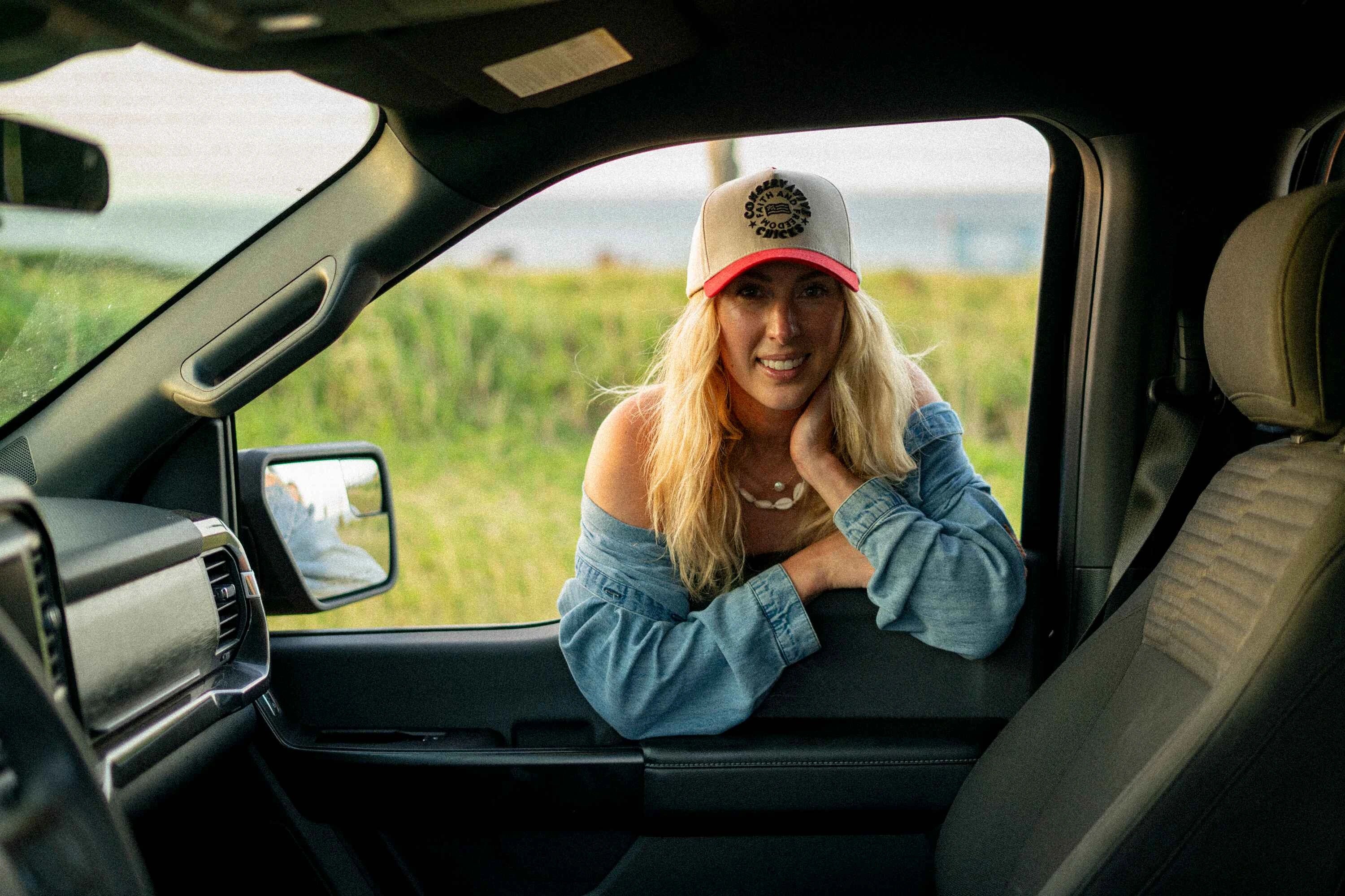 Lindsey looking through a car door